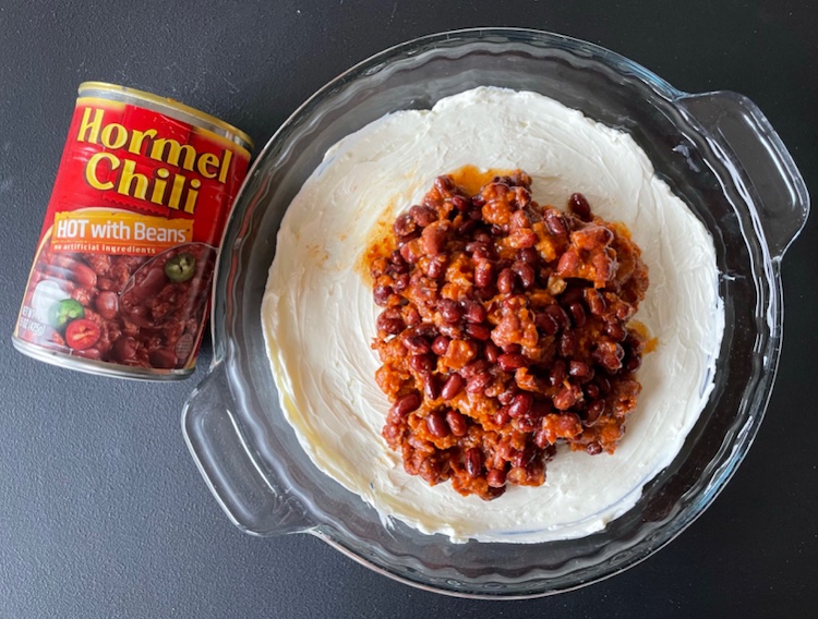 Easy Party Appetizer | Baked Chili Cheese Dip made with just a few ingredients! A block of cream cheese, a can of your favorite chili, and shredded cheese. 