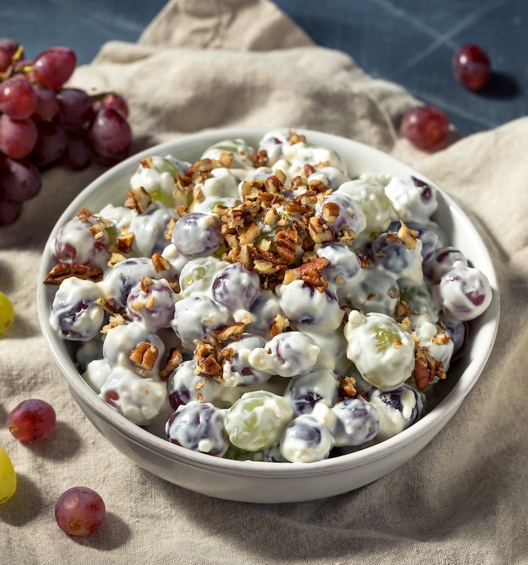 Yummy party food! This cheesecake grape salad is perfect for potlucks and backyard bbqs. The best sweet side dish! Super easy to make ahead of time. 