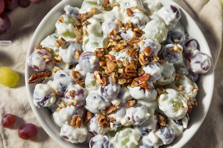 Grape Salad Recipe made with Cream Cheese and plain greek yogurt. NO sour cream. This quick and easy party food is wonderful served as a potluck dish, bbq side dish or for parties. A real crowd pleaser! Because it's served cold, you can make it ahead of time and it's easy to transport. 