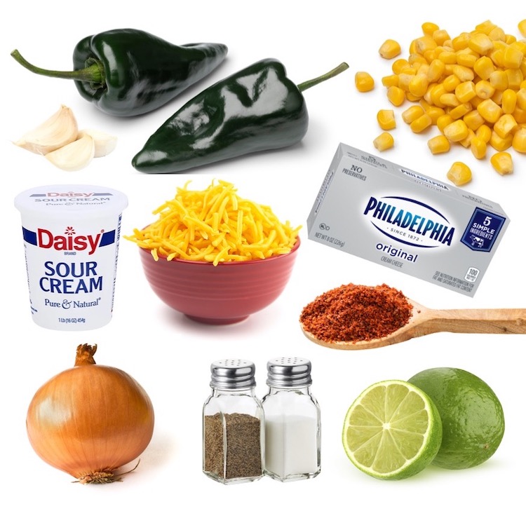 Ingredients for a Cheesy Poblano Corn Dip recipe including poblano peppers, frozen corn, cheddar cheese, cream cheese, sour cream, onion, lime juice, garlic and seasoning. 